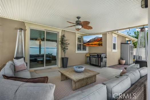 2056 Caltha Way, Perris, CA 92571 - view of patio / terrace with an outdoor living space and a ceiling fan