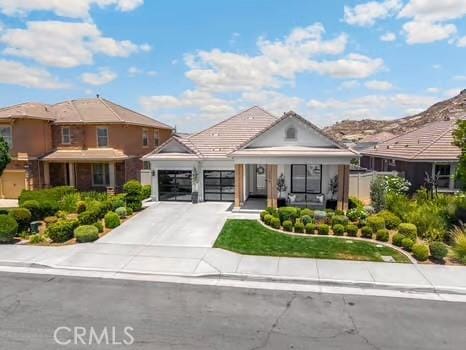 2056 Caltha Way, Perris, CA 92571 - view of front of property with an attached garage, driveway, and a porch