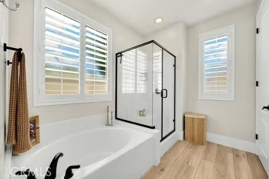 2056 Caltha Way, Perris, CA 92571 - bathroom with a garden tub, a stall shower, wood finished floors, and recessed lighting