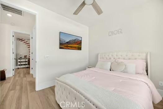 2056 Caltha Way, Perris, CA 92571 - bedroom with wood finished floors and ceiling fan