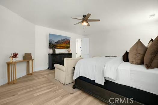 2056 Caltha Way, Perris, CA 92571 - bedroom featuring wood finished floors and a ceiling fan