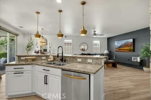 2056 Caltha Way, Perris, CA 92571 - kitchen with dishwasher, white cabinets, light wood-style floors, and open floor plan