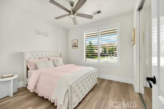 2056 Caltha Way, Perris, CA 92571 - bedroom with light wood-style flooring and ceiling fan