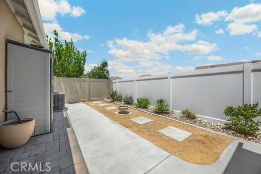 2056 Caltha Way, Perris, CA 92571 - fenced backyard featuring a patio
