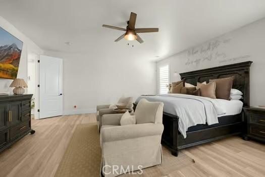 2056 Caltha Way, Perris, CA 92571 - bedroom with light wood-type flooring and ceiling fan