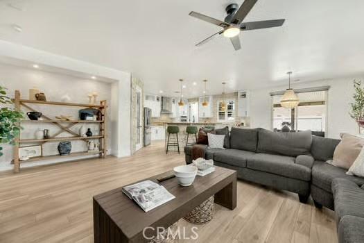 2056 Caltha Way, Perris, CA 92571 - living room featuring light wood finished floors and a ceiling fan