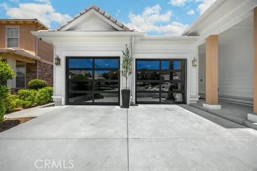 2056 Caltha Way, Perris, CA 92571 - doorway to property featuring a garage and driveway