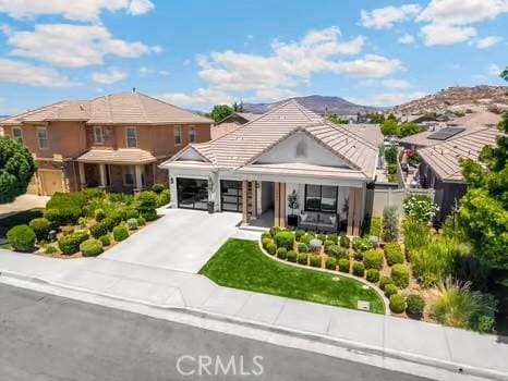 2056 Caltha Way, Perris, CA 92571 - view of front of property with concrete driveway and an attached garage