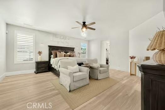 2056 Caltha Way, Perris, CA 92571 - bedroom with light wood-style floors and a ceiling fan