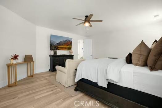 2056 Caltha Way, Perris, CA 92571 - bedroom with light wood finished floors and a ceiling fan