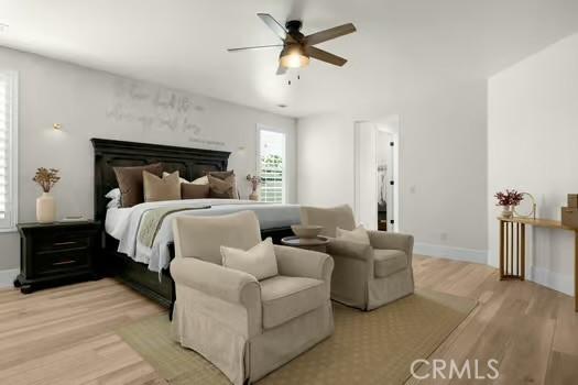 2056 Caltha Way, Perris, CA 92571 - bedroom with light wood-type flooring and ceiling fan
