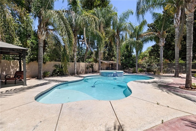 921 Christian Ave, Bakersfield, CA 93314 - view of swimming pool with a gazebo, a fenced backyard, a patio, and a pool with connected hot tub