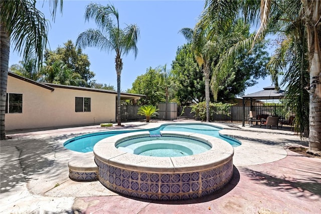 921 Christian Ave, Bakersfield, CA 93314 - view of swimming pool with a gazebo, a patio, a fenced backyard, and a pool with connected hot tub