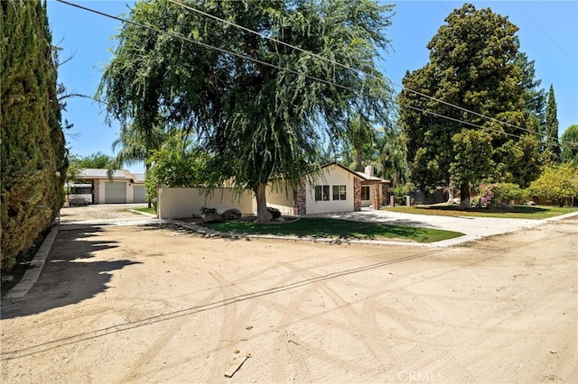921 Christian Ave, Bakersfield, CA 93314 - view of front of property with driveway and stucco siding