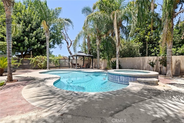 921 Christian Ave, Bakersfield, CA 93314 - view of swimming pool featuring a gazebo, a fenced backyard, a pool with connected hot tub, and a patio