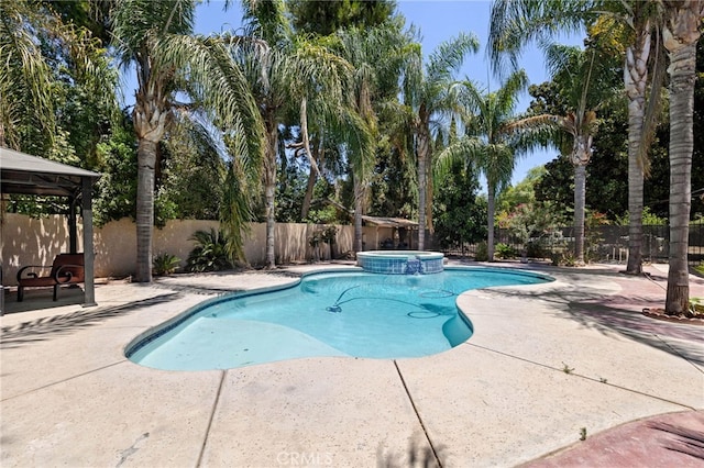 921 Christian Ave, Bakersfield, CA 93314 - view of swimming pool with a gazebo, a fenced backyard, a patio area, and a pool with connected hot tub