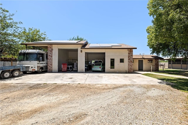 921 Christian Ave, Bakersfield, CA 93314 - view of front of property featuring roof mounted solar panels and stucco siding