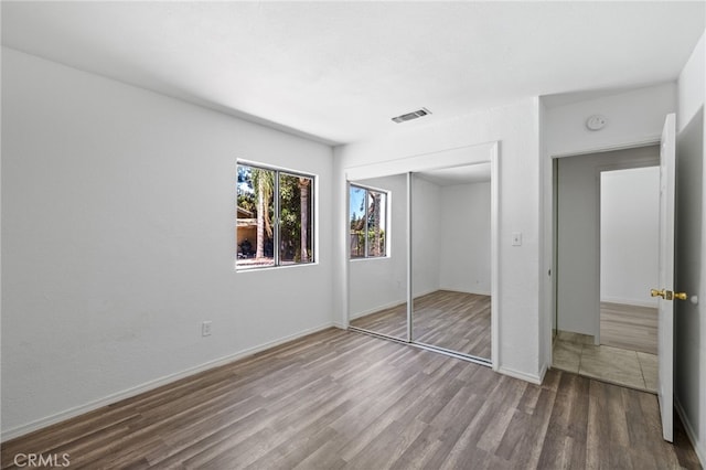 921 Christian Ave, Bakersfield, CA 93314 - unfurnished bedroom with wood finished floors and a closet