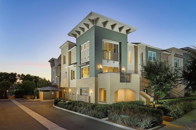 6140 Colt Pl Unit 104, Carlsbad, CA 92009 - view of front facade with stucco siding and a balcony