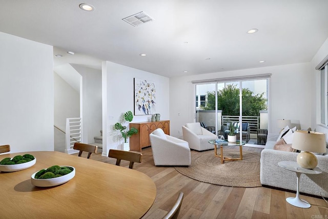 6140 Colt Pl Unit 104, Carlsbad, CA 92009 - living room with stairway, wood finished floors, and recessed lighting