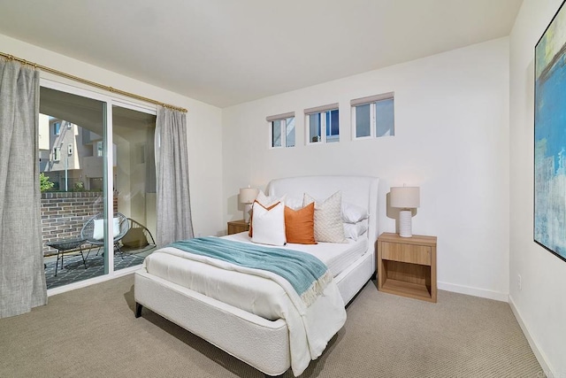 6140 Colt Pl Unit 104, Carlsbad, CA 92009 - carpeted bedroom featuring access to outside and baseboards