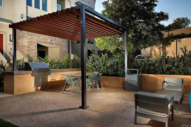 6140 Colt Pl Unit 104, Carlsbad, CA 92009 - view of patio featuring a pergola, an outdoor kitchen, and outdoor dining area