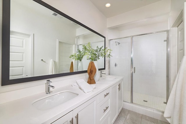 6140 Colt Pl Unit 104, Carlsbad, CA 92009 - full bath with double vanity, a shower stall, recessed lighting, and tile patterned flooring