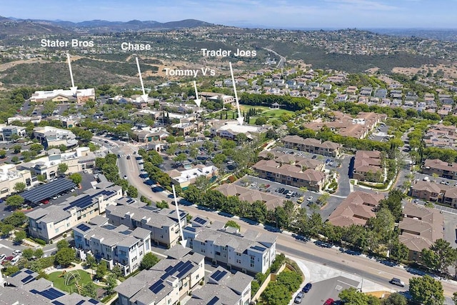 6140 Colt Pl Unit 104, Carlsbad, CA 92009 - aerial view of property's location with a mountainous background and nearby suburban area