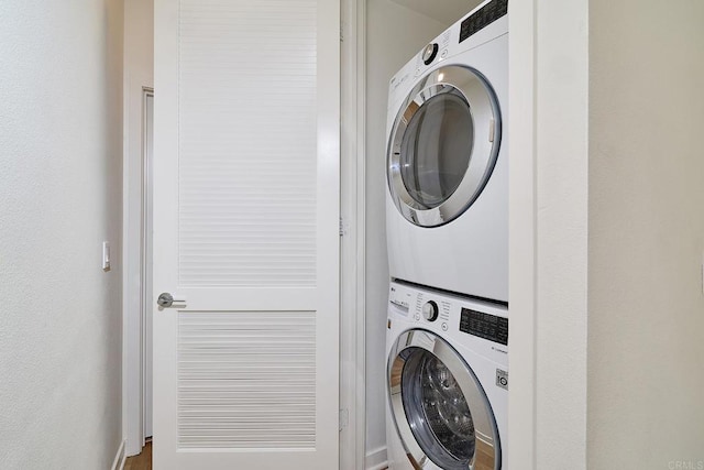6140 Colt Pl Unit 104, Carlsbad, CA 92009 - laundry area with stacked washing machine and dryer