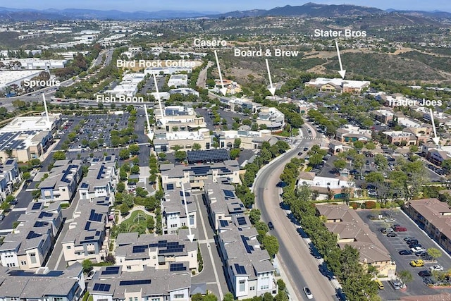 6140 Colt Pl Unit 104, Carlsbad, CA 92009 - aerial view of property's location with a mountain backdrop and nearby suburban area