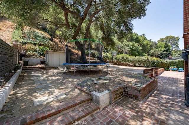 2248 E Chevy Chase Dr, Glendale, CA 91206 - view of patio with a trampoline and a shed