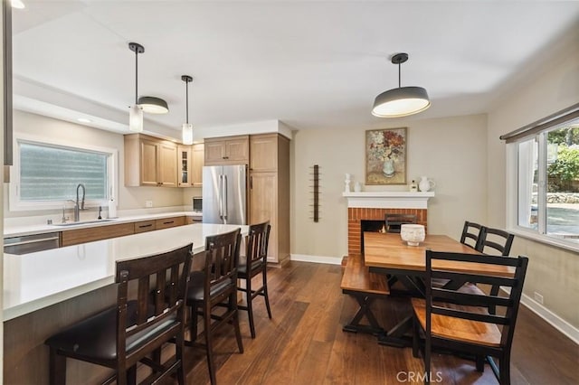 2248 E Chevy Chase Dr, Glendale, CA 91206 - dining room with dark wood finished floors, a brick fireplace, and recessed lighting