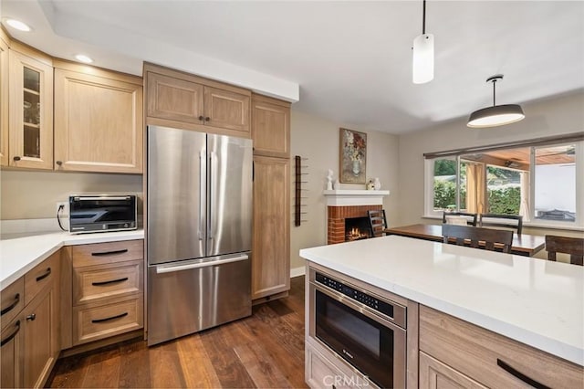 2248 E Chevy Chase Dr, Glendale, CA 91206 - kitchen featuring freestanding refrigerator, dark wood-style flooring, light countertops, recessed lighting, and a fireplace
