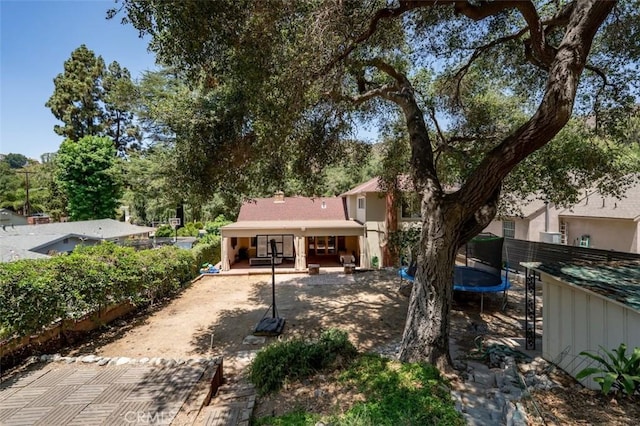 2248 E Chevy Chase Dr, Glendale, CA 91206 - back of house with a trampoline and a patio area