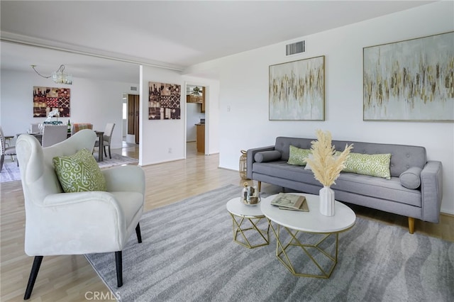 4931 Saint Andrews Ave, Buena Park, CA 90621 - living room featuring wood finished floors and a chandelier