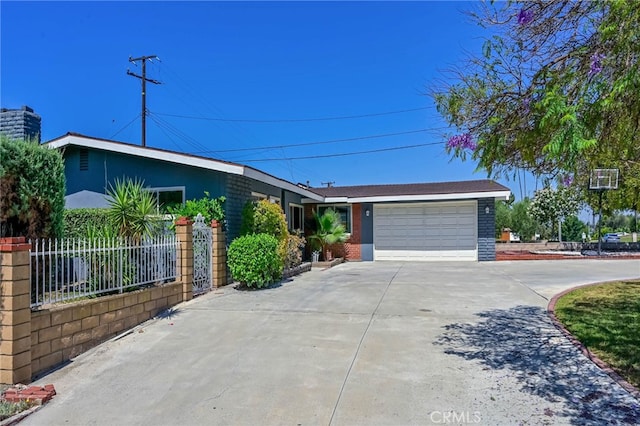 4931 Saint Andrews Ave, Buena Park, CA 90621 - view of front facade featuring driveway, a garage, and brick siding