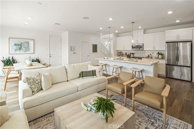 4830 Arroyo Run, Moorpark, CA 93021 - living area with dark wood-type flooring and recessed lighting