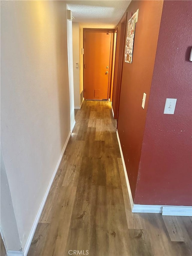 3539 Castaic, Riverside, CA 92501 - corridor featuring wood finished floors and baseboards