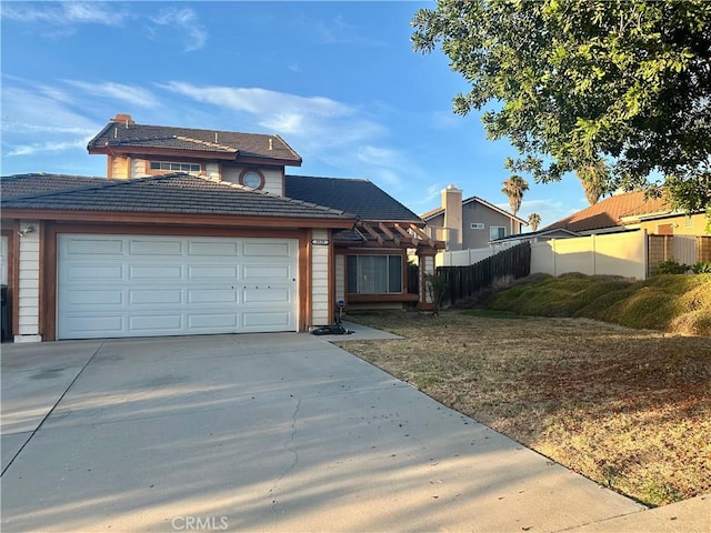 3539 Castaic, Riverside, CA 92501 - traditional-style home featuring concrete driveway, a tiled roof, and an attached garage