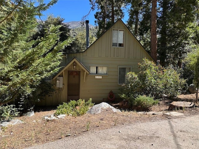 41132 Oak Dr, Forest Falls, CA 92339 - view of front of house with board and batten siding and a mountain view