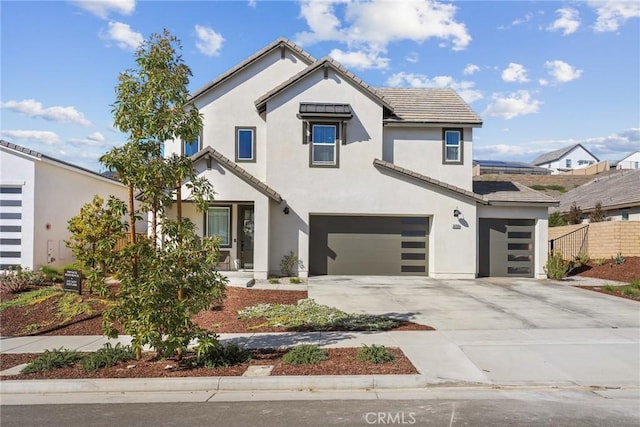 28709 Wildflower, Castaic, CA 91384 - view of front of property featuring a garage, a tile roof, driveway, and stucco siding