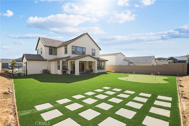 28709 Wildflower, Castaic, CA 91384 - back of house featuring a putting area, a fenced backyard, a patio area, and stucco siding