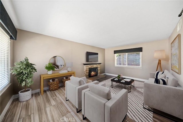 3911 Bryce Ct, Chino, CA 91710 - living area with healthy amount of natural light, a fireplace, and light wood-style flooring