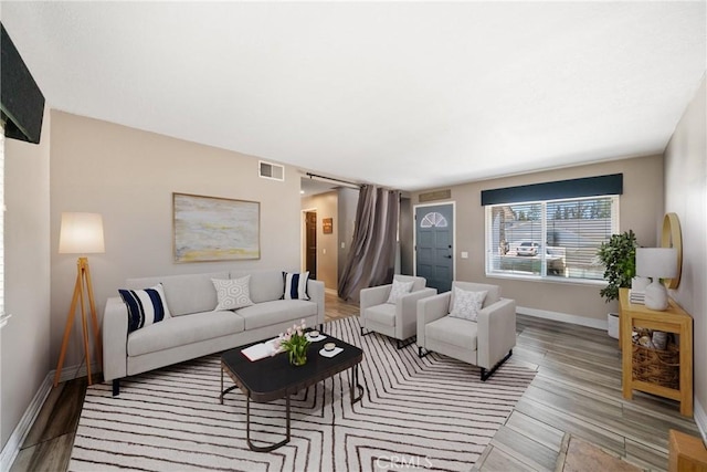 3911 Bryce Ct, Chino, CA 91710 - living area with light wood-style flooring and baseboards