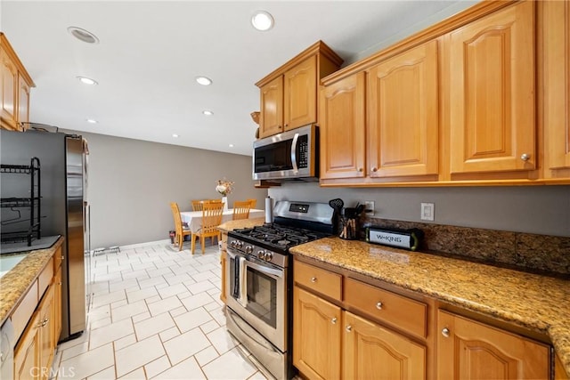 3911 Bryce Ct, Chino, CA 91710 - kitchen featuring stainless steel appliances, light stone countertops, and recessed lighting