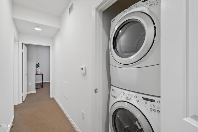 931 E Walnut St Unit 612, Pasadena, CA 91106 - laundry area featuring estacked washer and dryer and carpet
