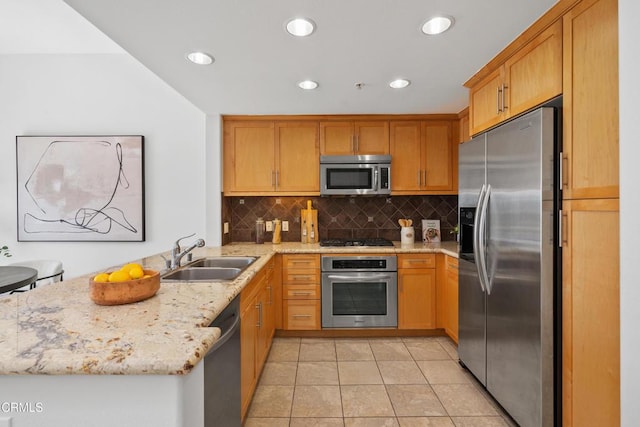 931 E Walnut St Unit 612, Pasadena, CA 91106 - kitchen featuring appliances with stainless steel finishes, a peninsula, light stone counters, backsplash, and recessed lighting