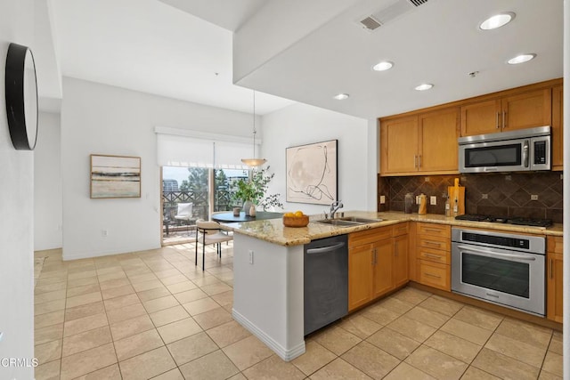 931 E Walnut St Unit 612, Pasadena, CA 91106 - kitchen featuring appliances with stainless steel finishes, light tile patterned flooring, decorative backsplash, a peninsula, and recessed lighting