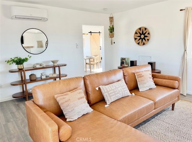 3191 Pearl Springs Ave Unit 29, Palms, CA 92277 - living area with an AC wall unit and wood finished floors