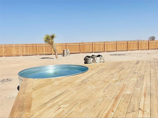 3191 Pearl Springs Ave Unit 29, Palms, CA 92277 - view of pool featuring a fenced backyard and a wooden deck